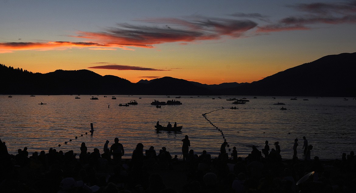 Boats dot Whitefish Lake and crowd at City Beach grows Tuesday before the start of the Whitefish Chamber of Commerce&#146;s annual Fourth of July fireworks show over the lake. (Heidi Desch/Whitefish Pilot)