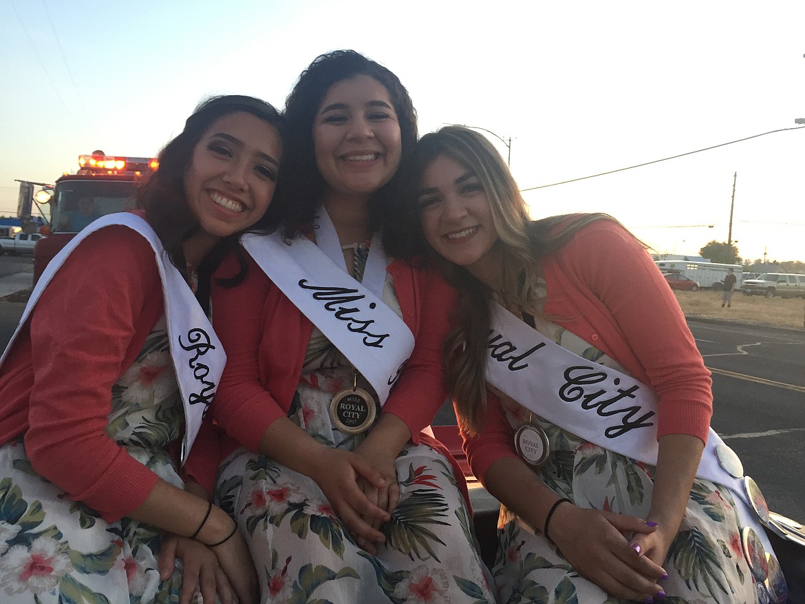 Courtesy photo - Current Royal City Distinguished Young Woman Denisse Arroyo, center, and her court will pass in review at The Royal City SumerFest Parade on Saturday, July 15. With her at the Moses Lake Parade on May 27 were First Runner-up Leslie Moreno, left, and Second Runner-up, Yajaira Michel.