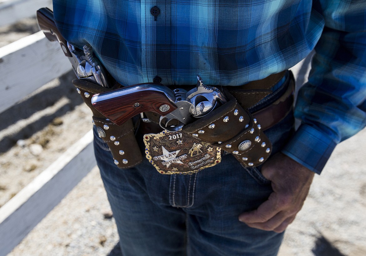 LOREN BENOIT/PressRob Boucher showcases his old style 45 at the Idaho State Mounted Shoot Out Friday afternoon at the Kootenai County Fairgrounds.