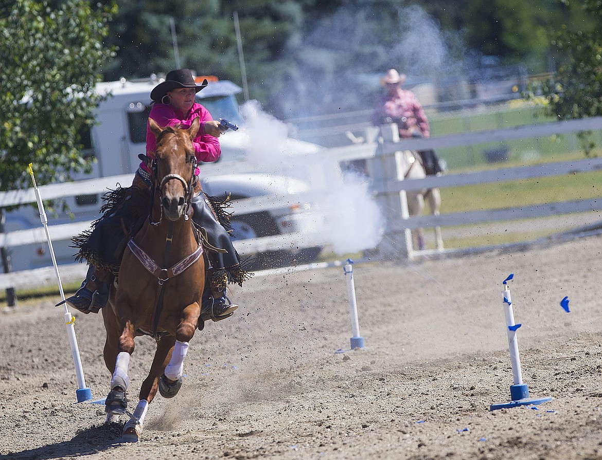 LOREN BENOIT/PressShanda Nagle, of Athol, competes in the Idaho State Mounted Shoot Out Friday afternoon at the Kootenai County Fairgrounds.