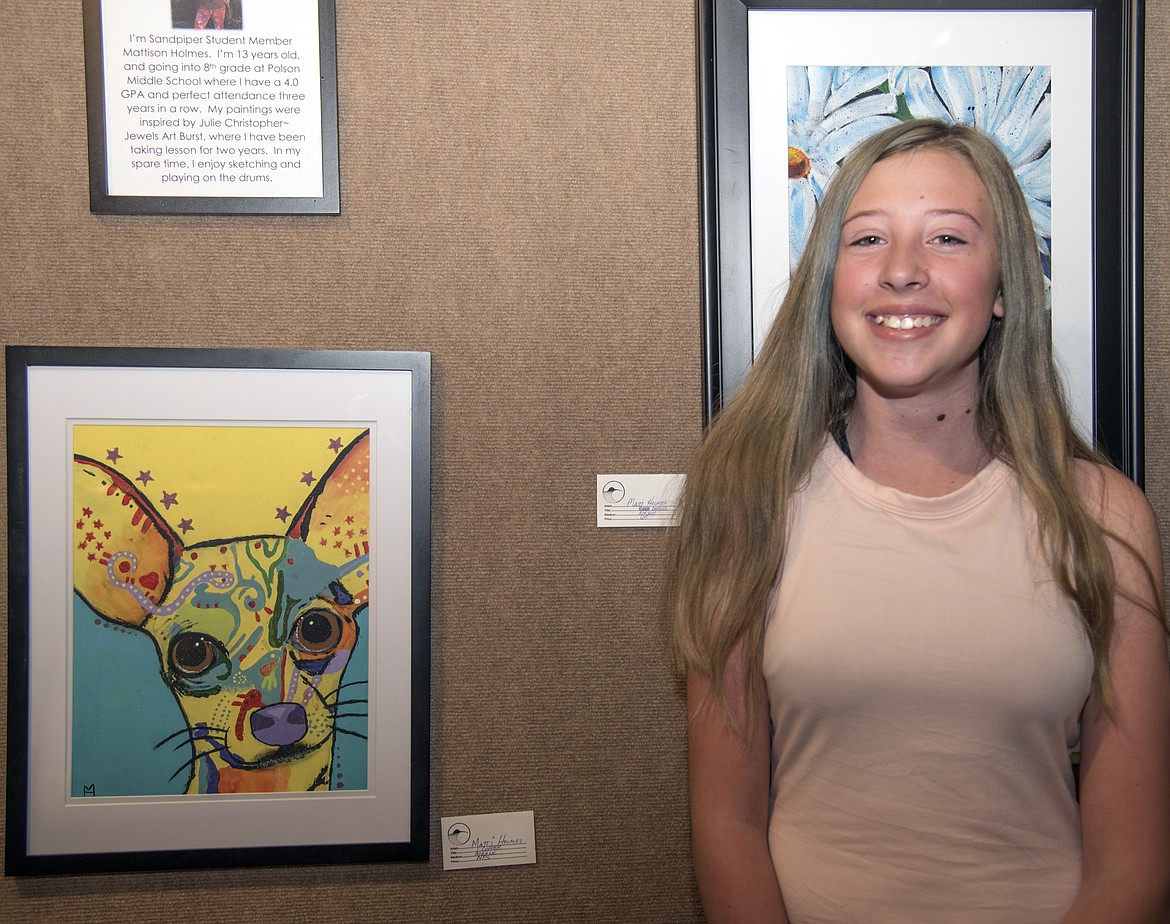 Mattie Holmes, who will be in the 8th grade this fall, shows her &#147;pop art&#148; piece featuring her dog &#147;Copper.&#148; (Marla Hall/Lake County Leader)