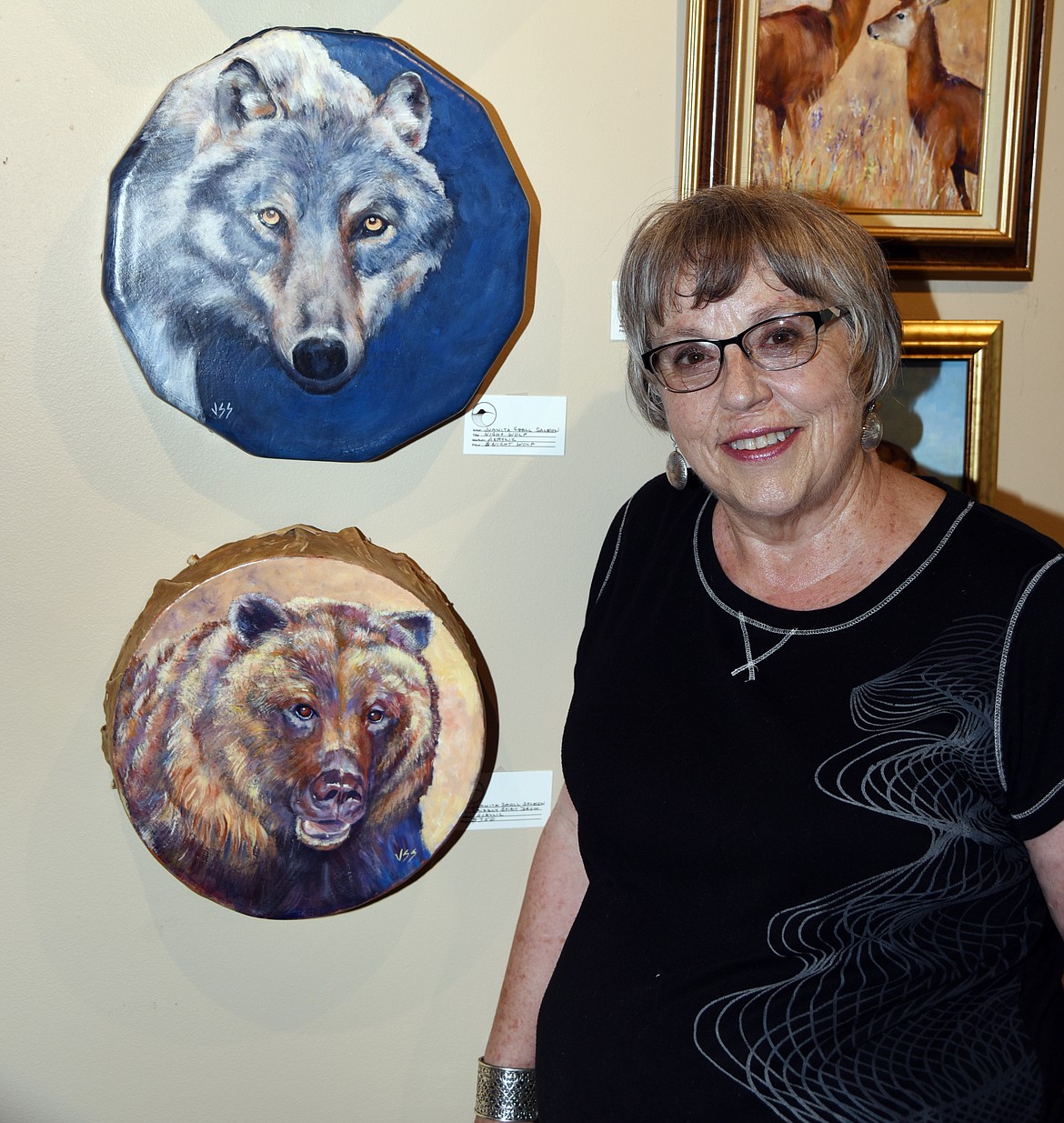 Juanita Small Salmon preserves old native drums by painting beautiful works of art on them for display. (Marla Hall/Lake County Leader)