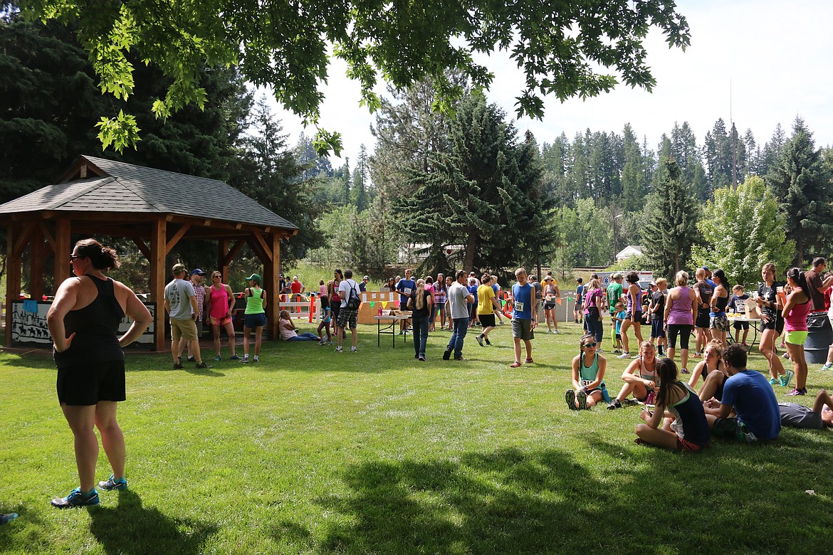 Photo by Mandi Bateman
Participants relax, drink, eat fresh fruit, and share stories after the Kootenai River Run.