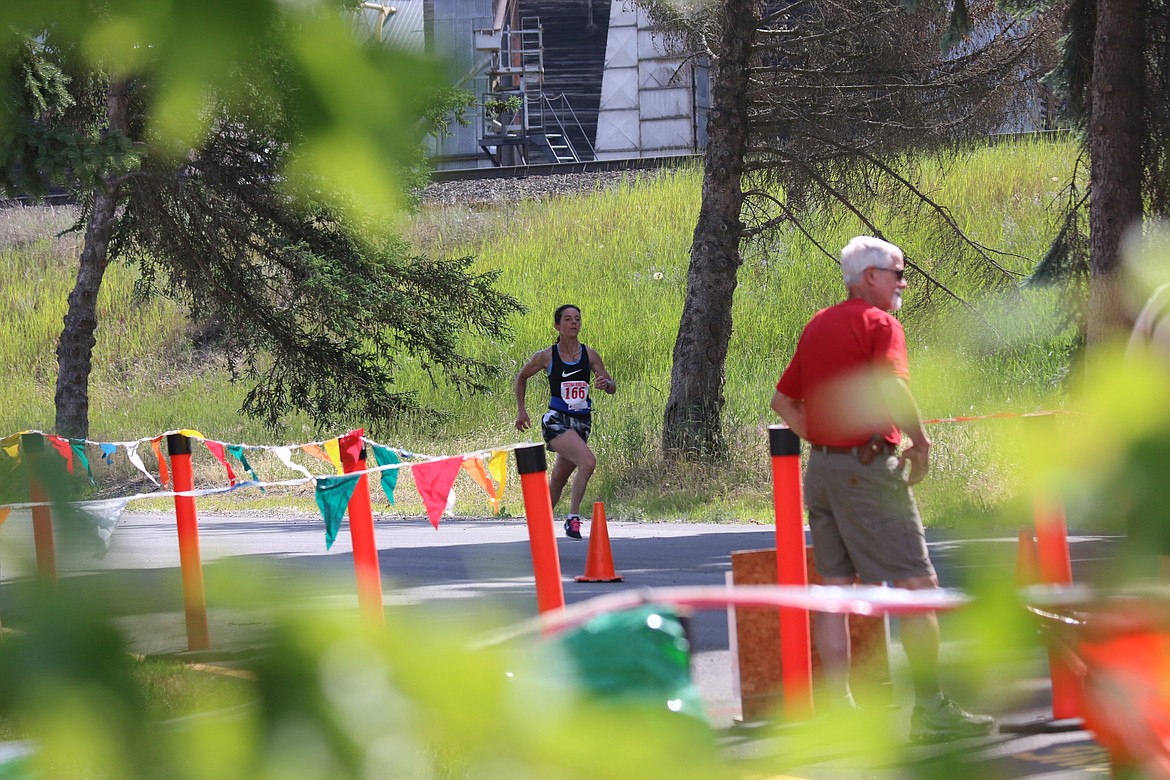 Photo by Mandi Bateman
Darce Claus, about to cross the finish line to win the women&#146;s 10K with a time of 47:41.