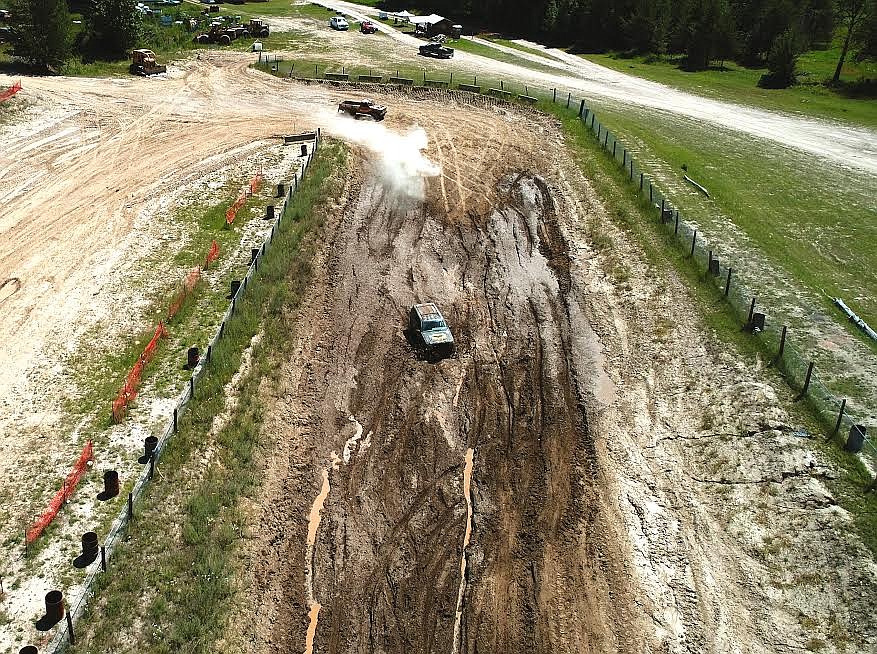 Photo by Lee Yeoumans
Two views of Teresa Lummus &#151; known as &#147;Batgirl&#148; because she flies through the mud pits so fast &#151; as she takes to the course at the Moyie Mudbogs event this past weekend. The above photo was taken from above with the help of a drone ...