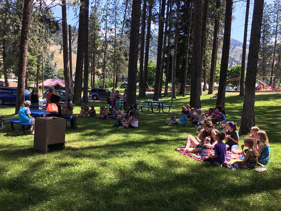 A group of kids met Smokey the Bear in Eva Horning Park during the library&#146;s Summer Reading Program.