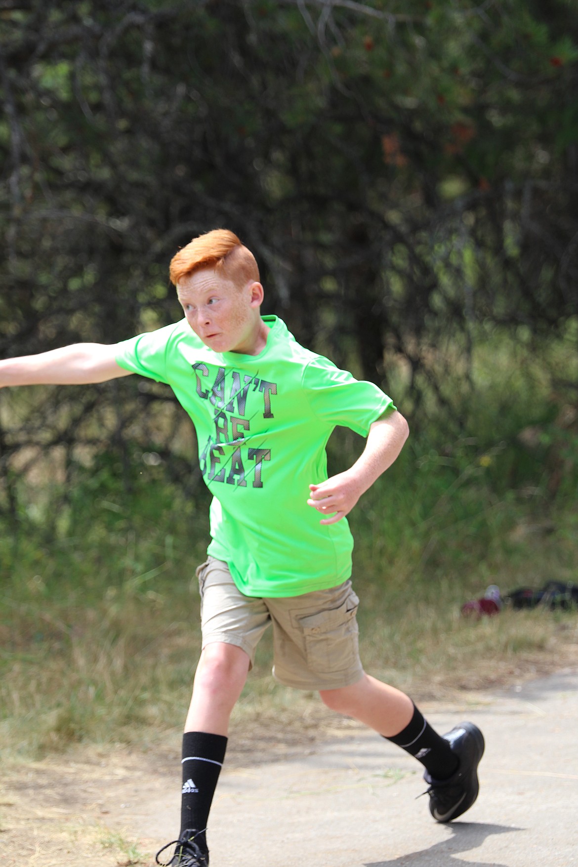 Photo by GEOFF CARR
Ethan Hebert, the youngest competitor in the tournament, unleashes a drive on No. 18.