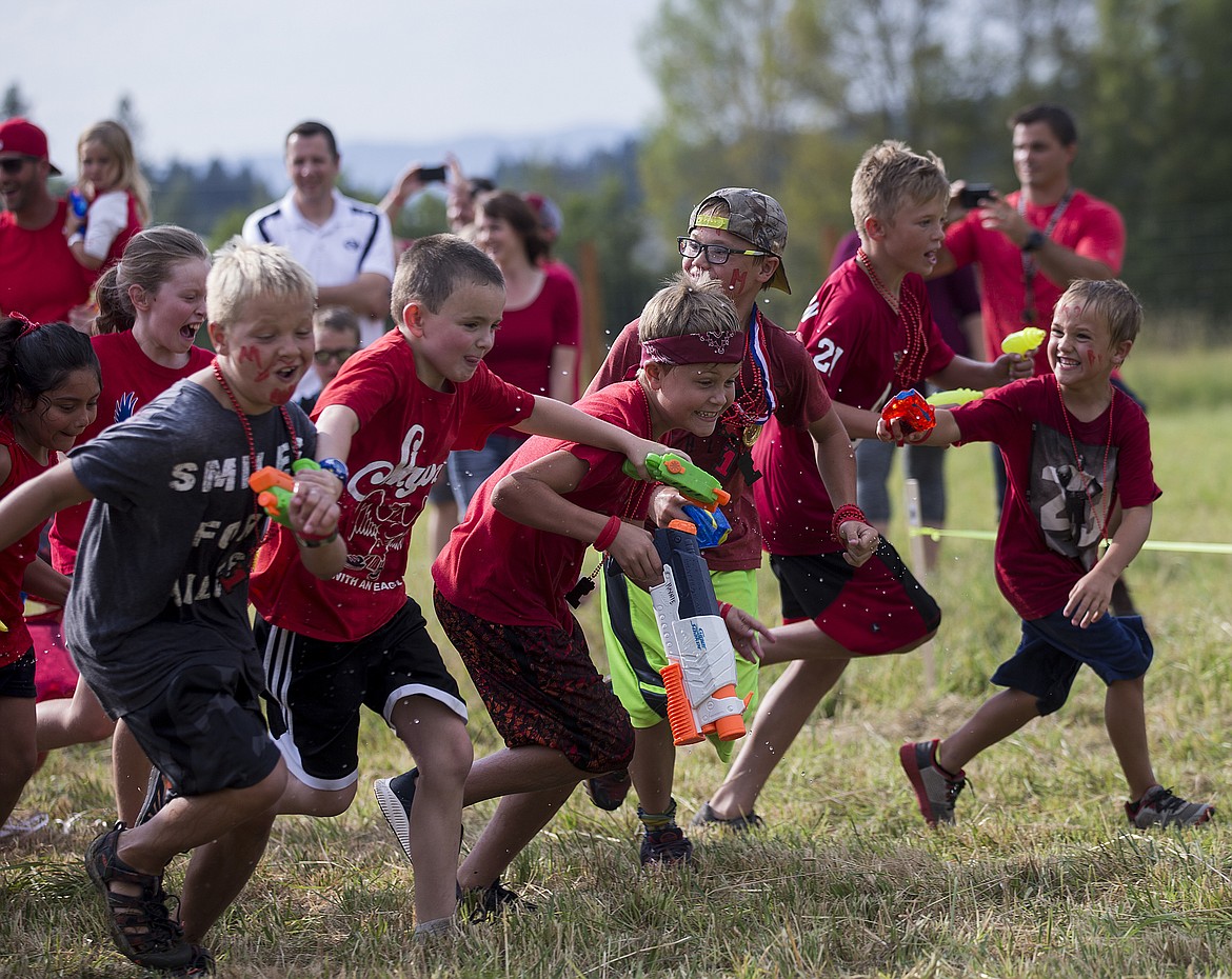 LOREN BENOIT/Press
Next to friends, Elliot Haynie, center, bursts off the starting line at the Smiles for Miles Fun Run. The Haynie family suffered the abrupt loss of one of their 5-year-olds, Miles, on July 22 of last year. In honor of him about 300 people came to the Hayden property, owned by Haynie friends Matt and Sarah Zastrow, to show their support for the Haynie family.