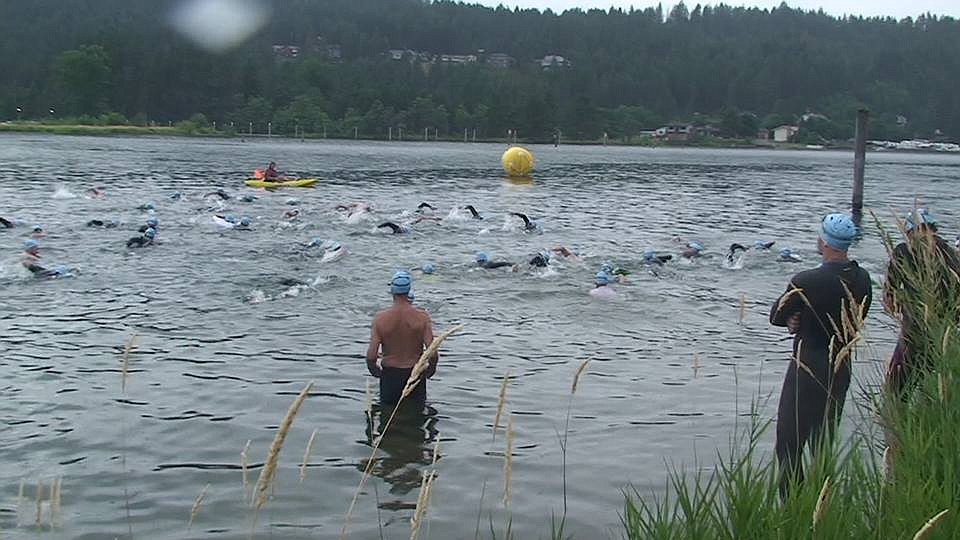 Courtesy photos
Triathletes compete in the swim portion of the Race The River sprint triathlon in July 2016.