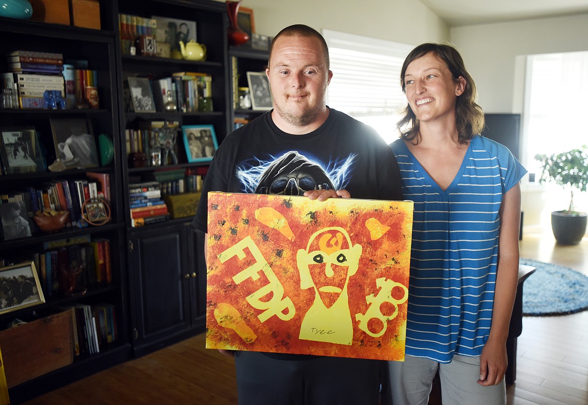 TYEE PANCHERI and his sister Mandee Johnson display a piece of their artwork. (Brenda Ahearn photos/Daily Inter Lake)