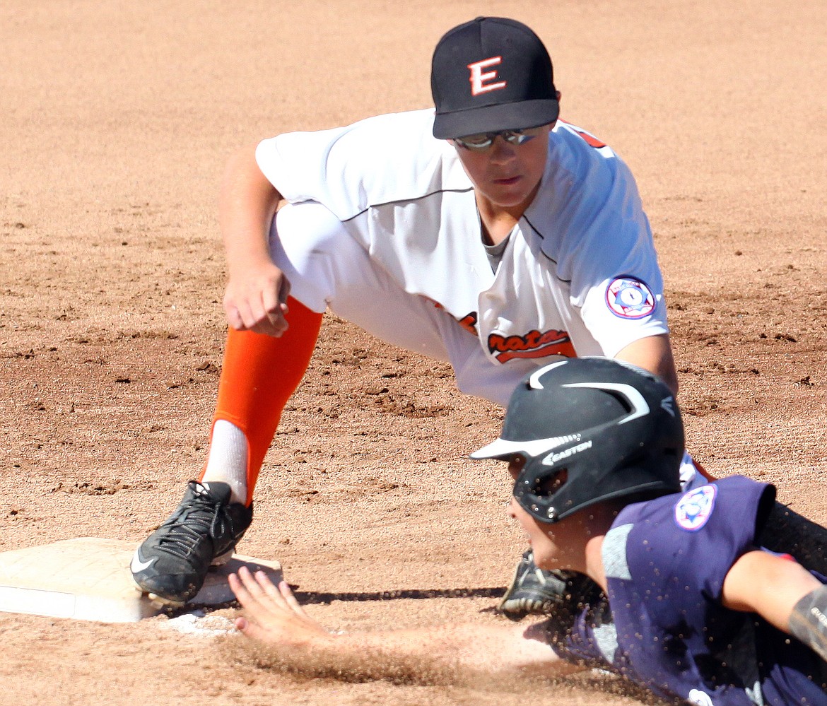 Rodney Harwood/Columbia Basin Herald
Ephrata third baseman Brock Hussey tags Moses Lake runner Carson Janke out as he slides back into the base during Friday's North Washington Babe Ruth 13-year-old championship game.