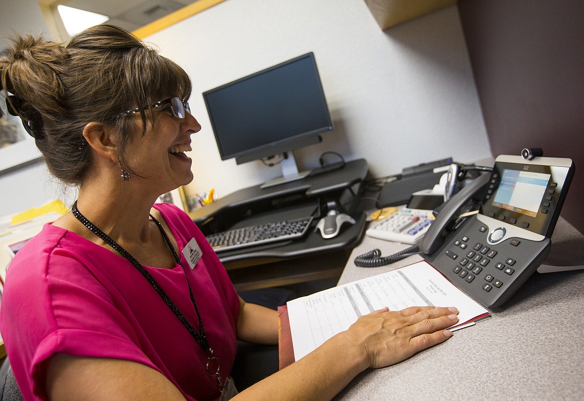 Rayelle Anderson, North Idaho College foundation executive director, smiles as she talks to Robert Swider, of Hayden, telling him he won a new house, appraised at $350,000, during NIC&#146;s Really BIG Raffle drawing Wednesday night.