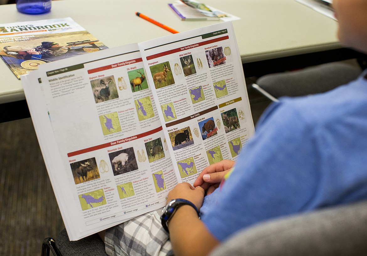 LOREN BENOIT/PressA student reads through deer and bear classifications during a hunter education course Wednesday morning at Idaho Fish and Game.