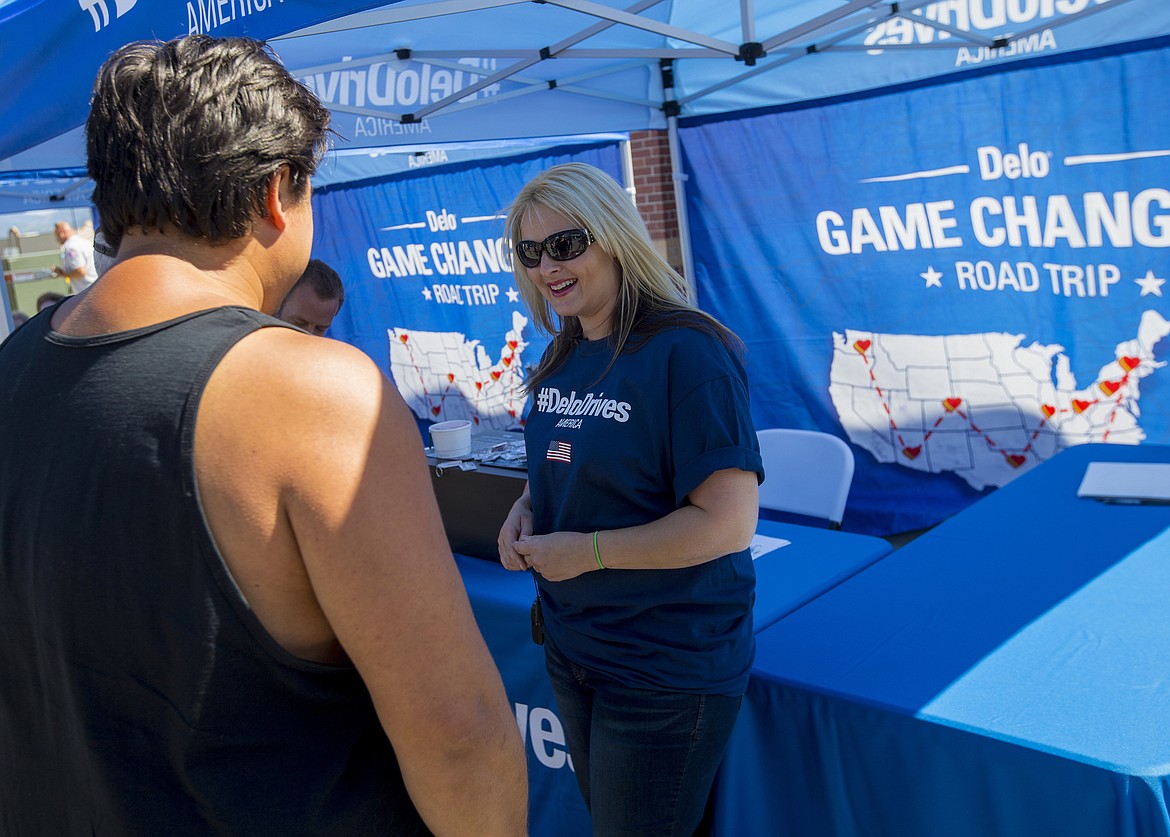 LOREN BENOIT/PressTrucker Stan Senchemko chats with Lisa Kelly from HISTORY Channel&#146;s Ice Road Truckers Tuesday morning at Love&#146;s Travel Stops in Post Falls. From July through September, Chevron and Lisa Kelly, will travel coast to coast meeting, greeting and celebrating today's Game Changers.