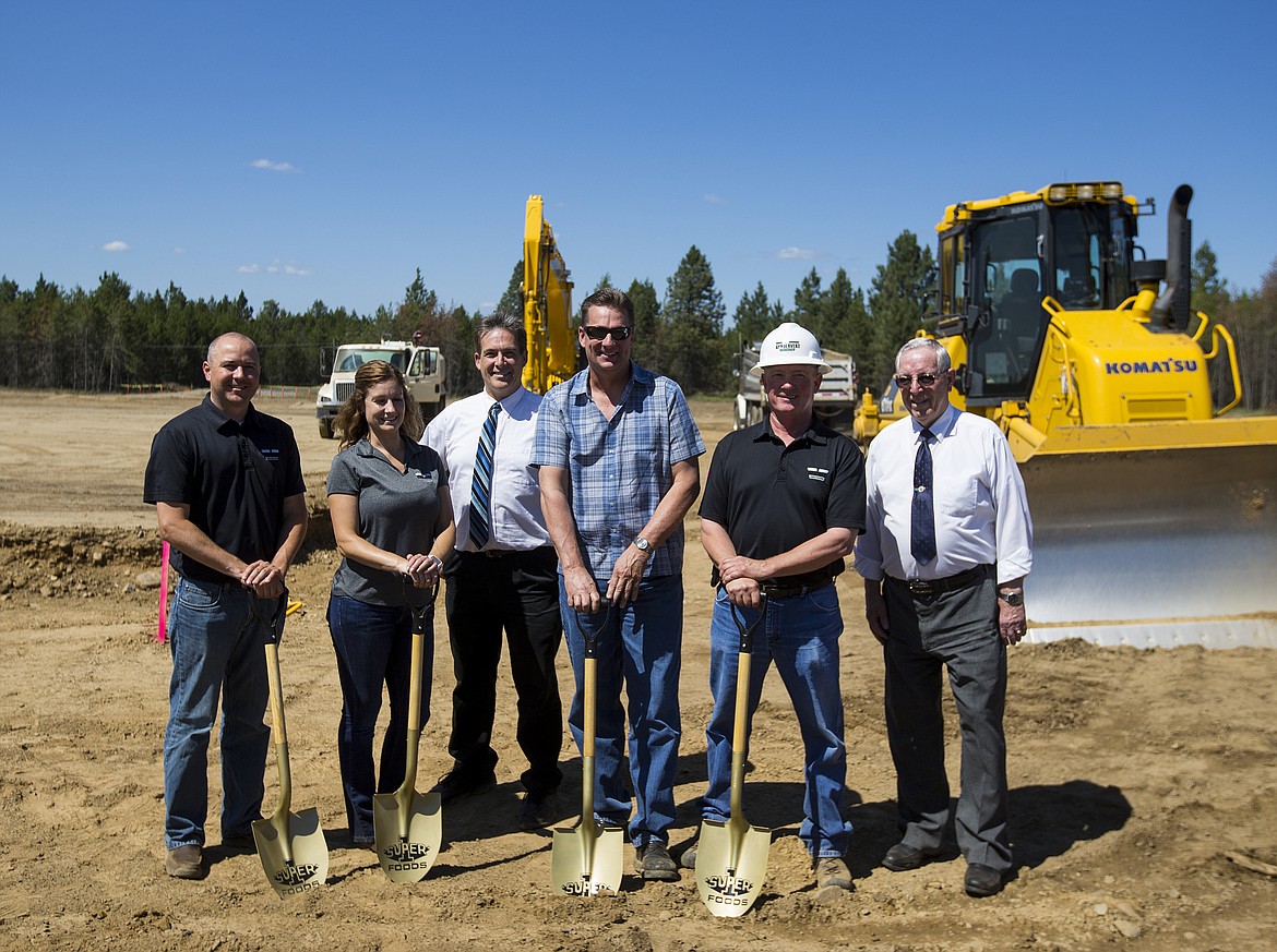 LOREN BENOIT/Press
From left, Conor Craigen and Kathryn Piraino with Vandervert Construction, Randy McIntire with Super 1 Foods, Norval Luth with Market Equipment, Vic DeTienne with Vandervert and Ron McIntire with Super 1 Foods break ground at the new 57,000-square-foot Super 1 Foods site at The Crossings in Athol.