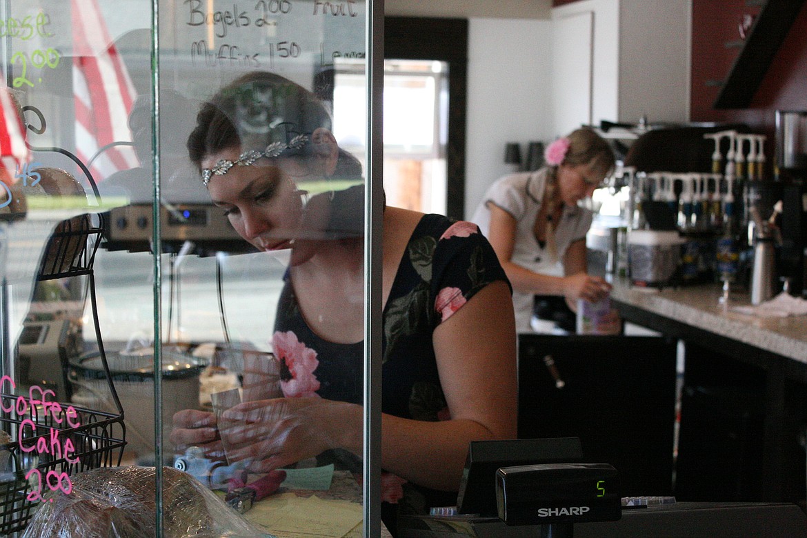 Victoria Hibpshman, foreground, and Josie Girod, owners of 7 Seeds Specialty Coffee in Libby, opened their business July 14. Located at 903 A Mineral Ave. at the corner of Highway 2 and Mineral Avenue, their shop offers sandiwches and pastries in additional to coffee and specialty drinks. They also have drive-through service. (Elka Wood/The Western News)