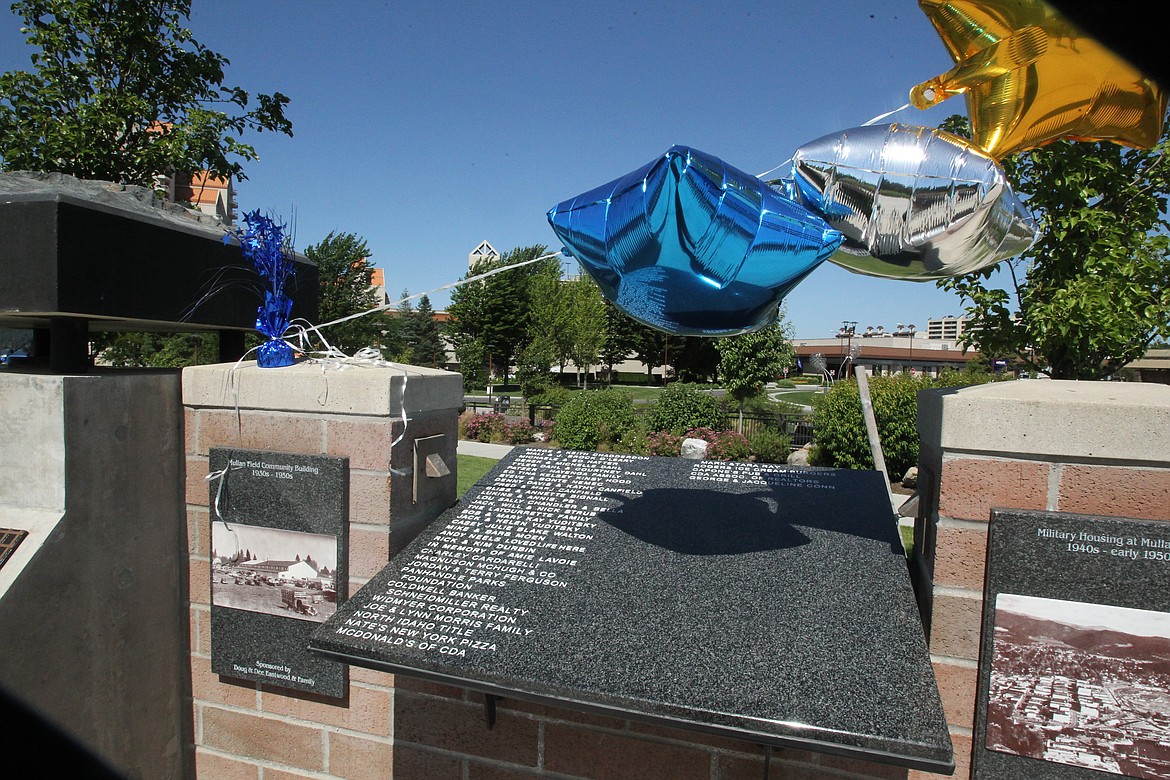 DEVIN HEILMAN/Press
Blue, silver and gold balloons wave in the breeze above a granite plaque of the McEuen Donor Wall, which had names blasted into it early Tuesday morning. Representatives of the Panhandle Parks Foundation and K27 Project Committee had an informational table in the park to update the community about the progress of the K27 Memorial and donor wall opportunities.