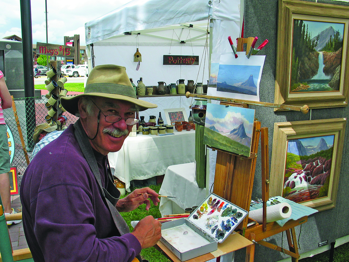 Artist Robert Marceau at his booth during a previous Arts in the Park event. (Photo by Brian Eklund/Courtesy of the Hockaday Museum of Art)