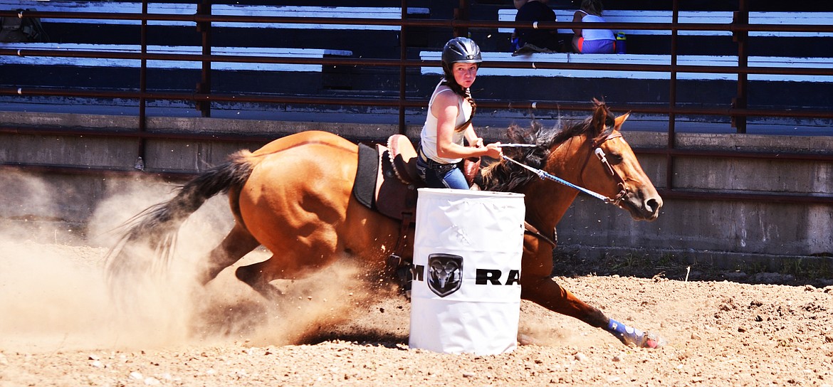 HAILEY WEIBLE takes a tight turn around the first barrel in the Barrel Race event. (Erin Jusseaume/Clark Fork Valley Press)