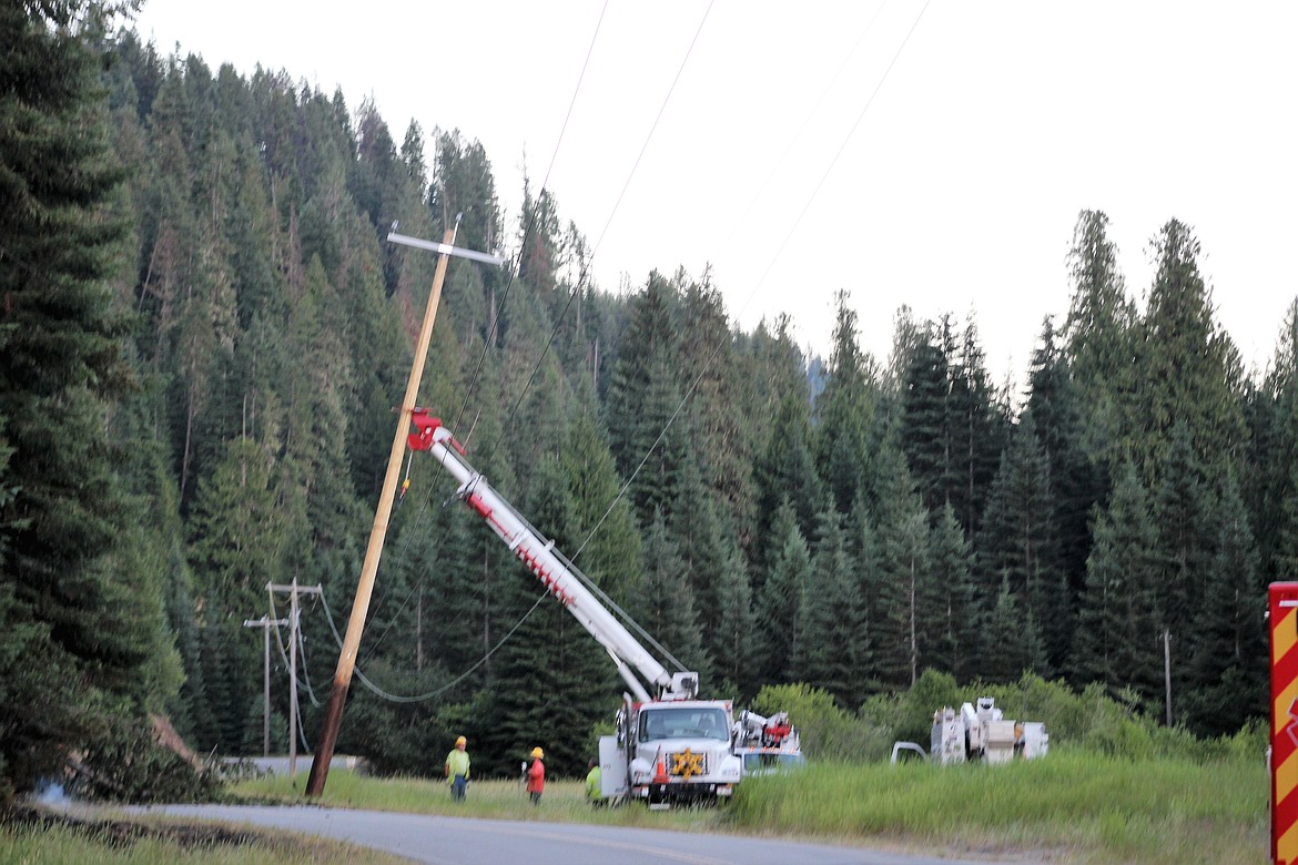 A new power pole is installed with the hopes of returning power to the Prichard/Murray area soon.