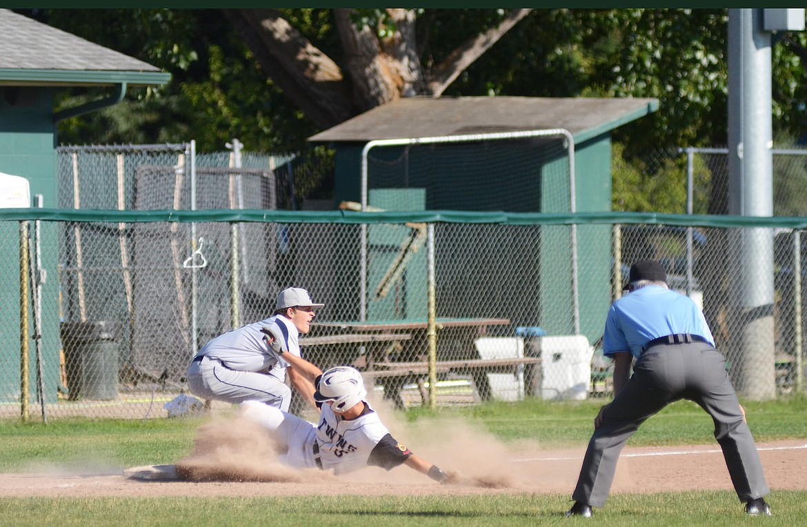 Gunner Marsh beats the tag at third for a triple on Wednesday against the Missoula Mavericks. (Daniel McKay photos/Whitefish Pilot)