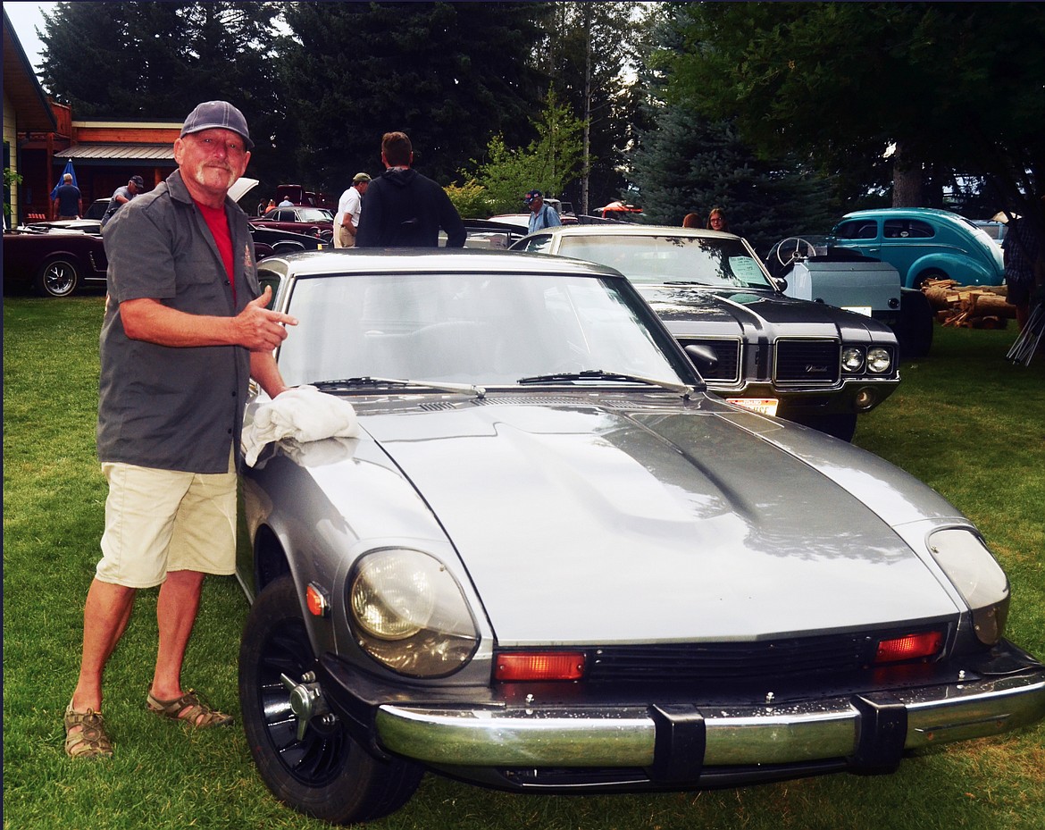 Idaho enthusiast Tim Sebers preparing his 1976 Datsun for the show. (Erin Jusseaume/Clark Fork Valley Press)