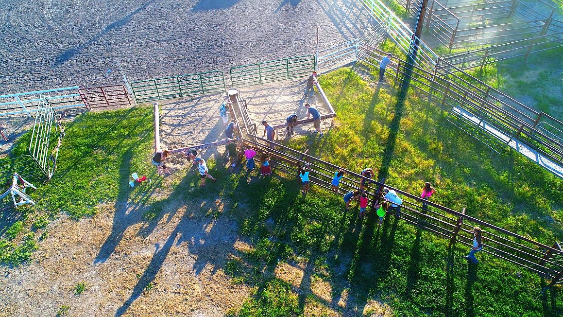 Photo By Lee Yeoumans
Mountain Springs Church Youth Group, led by Justin Gibbons, had a barbeque and clean up at the Boundary County Fairgrounds on Wednesday July 5, following the Fourth of July celebration. They sanded and repainted the arena fencing, weeded, and cleaned up the grandstands.