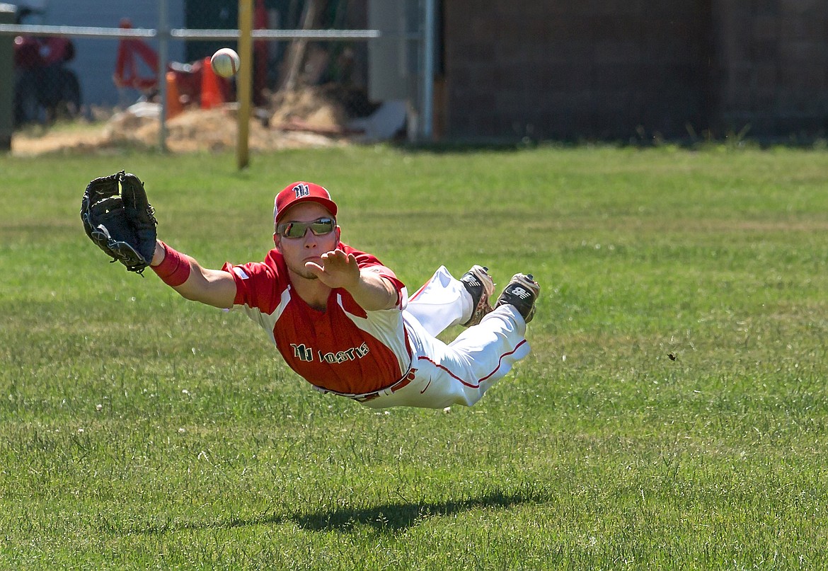 (Photo by Bill Anthony Photography)
North Idaho Legion outfielder Wes Holland covered 30 yards before laying out to make a diving catch in a sweep of Orofino over the weekend, as captured in this excellent shot.