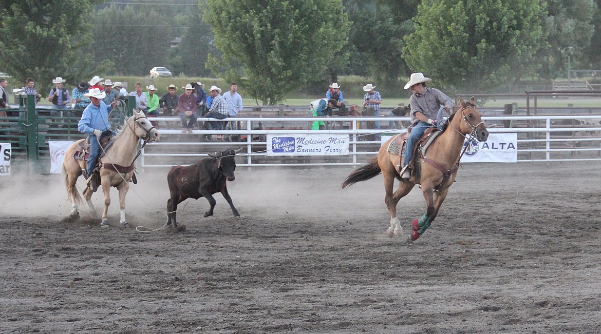 Photos by Tanna Larsen
Jesse Luther and Don Smith team up against a steer in the Team Roping competition at the Kootenai River Days Selkirk Saddle Club Bull Bash, July 8 at the Boundary County Fairgrounds.