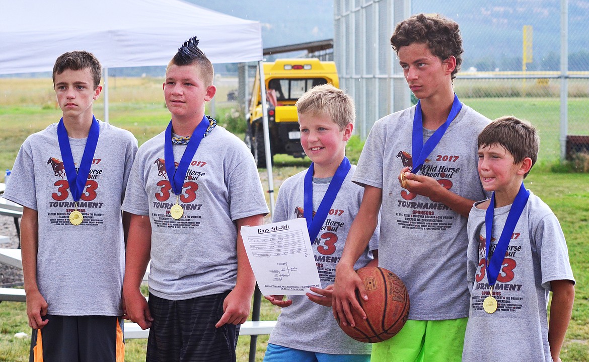 LOCALS Trents McDonald, Kody Carter, Nate Hathorne, Gavin Regaled and Darren Standford won 7th and 8th grade division of the Wild Horse 3-on-3 baskebtall tournament this weekend. (Erin Jusseaume/Clark Fork Valley Press)