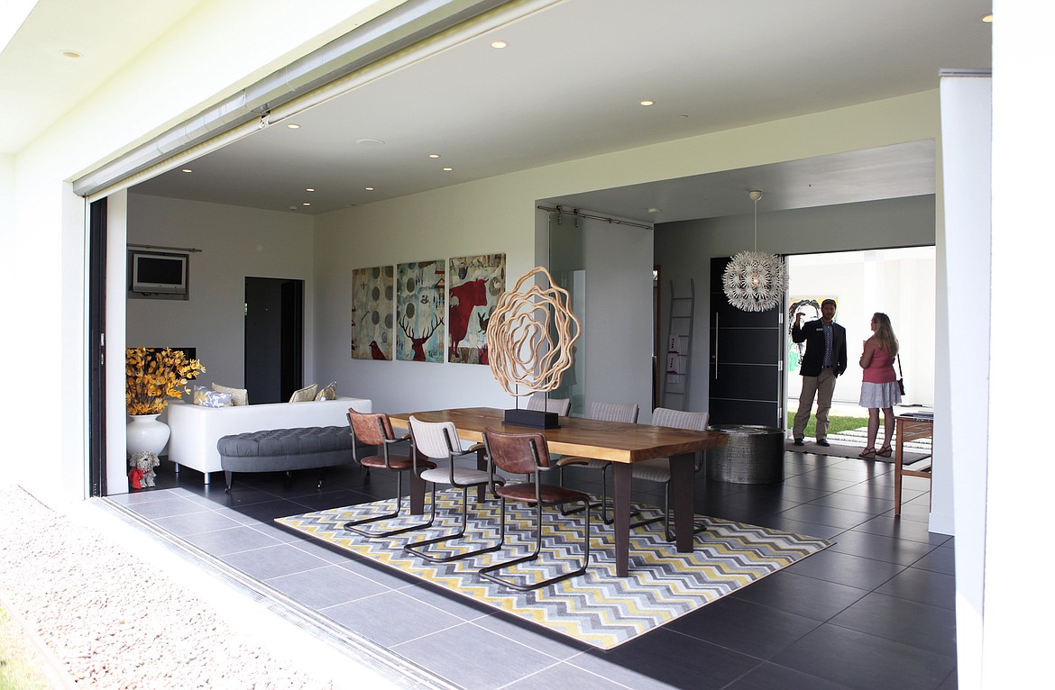 Pocket doors pull back to provide a 21-foot opening in the living room of Garry Tallent's Whitefish vacation home which is set to be auctioned July 18. (Mackenzie Reiss/Daily Inter Lake)