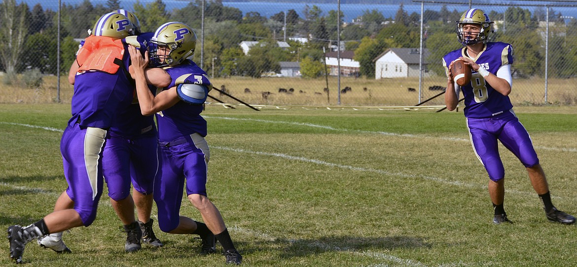 FORMER POLSON quarterback, and 2017 University of Montana signee, Tanner Wilson drops back to practice in a 2016 Pirates' practice at Polson High School. Wilson, along with Rensvold, were two Pirates selected to play in the Shrine Bowl game. (Jason Blasco/Lake County Leader)