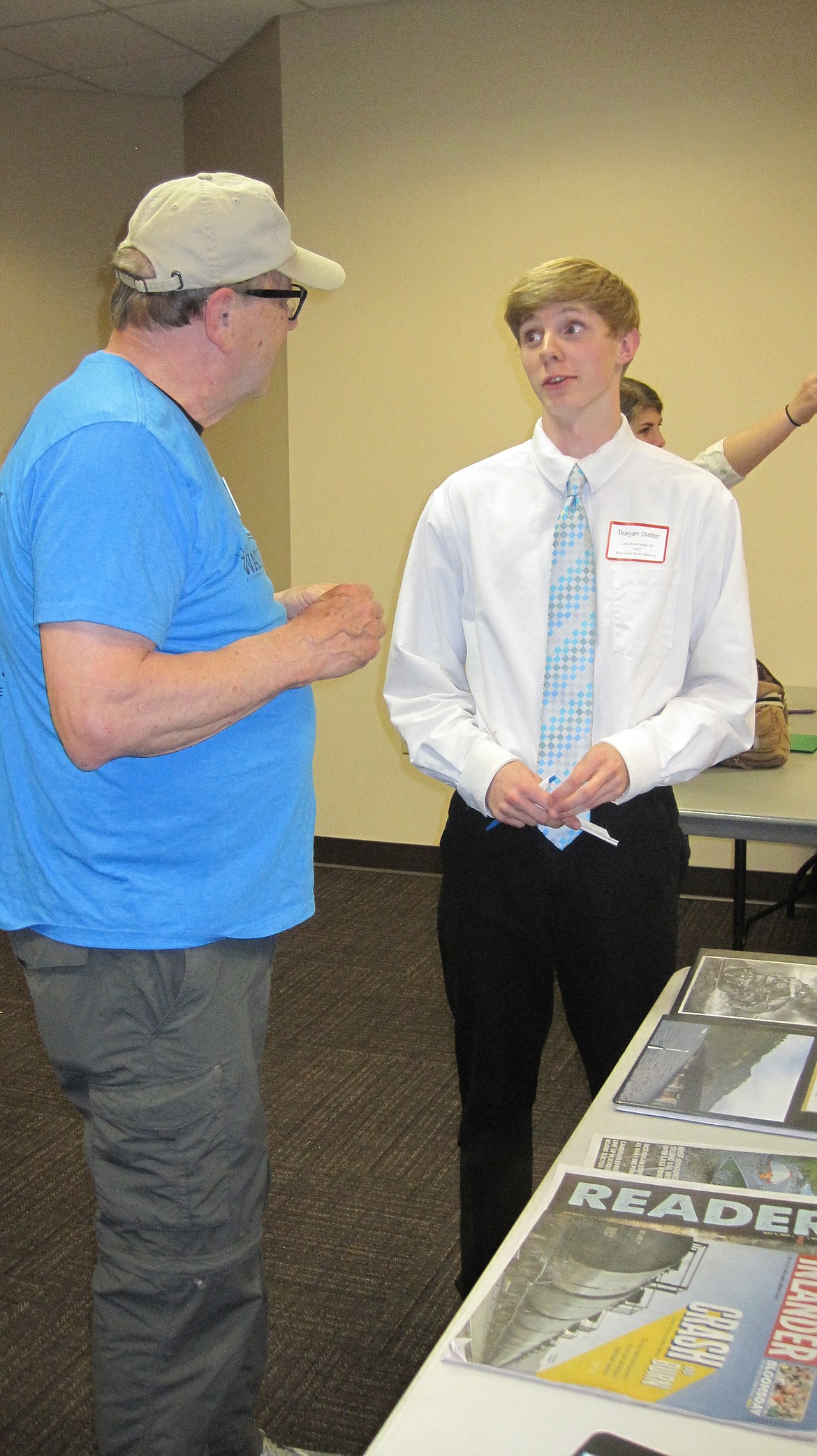 (Courtesy photo)
Teagan Dieter, right, talks about his project on coal trains at the Idaho Water Summit recently at North Idaho College. He earned first-place for his project.