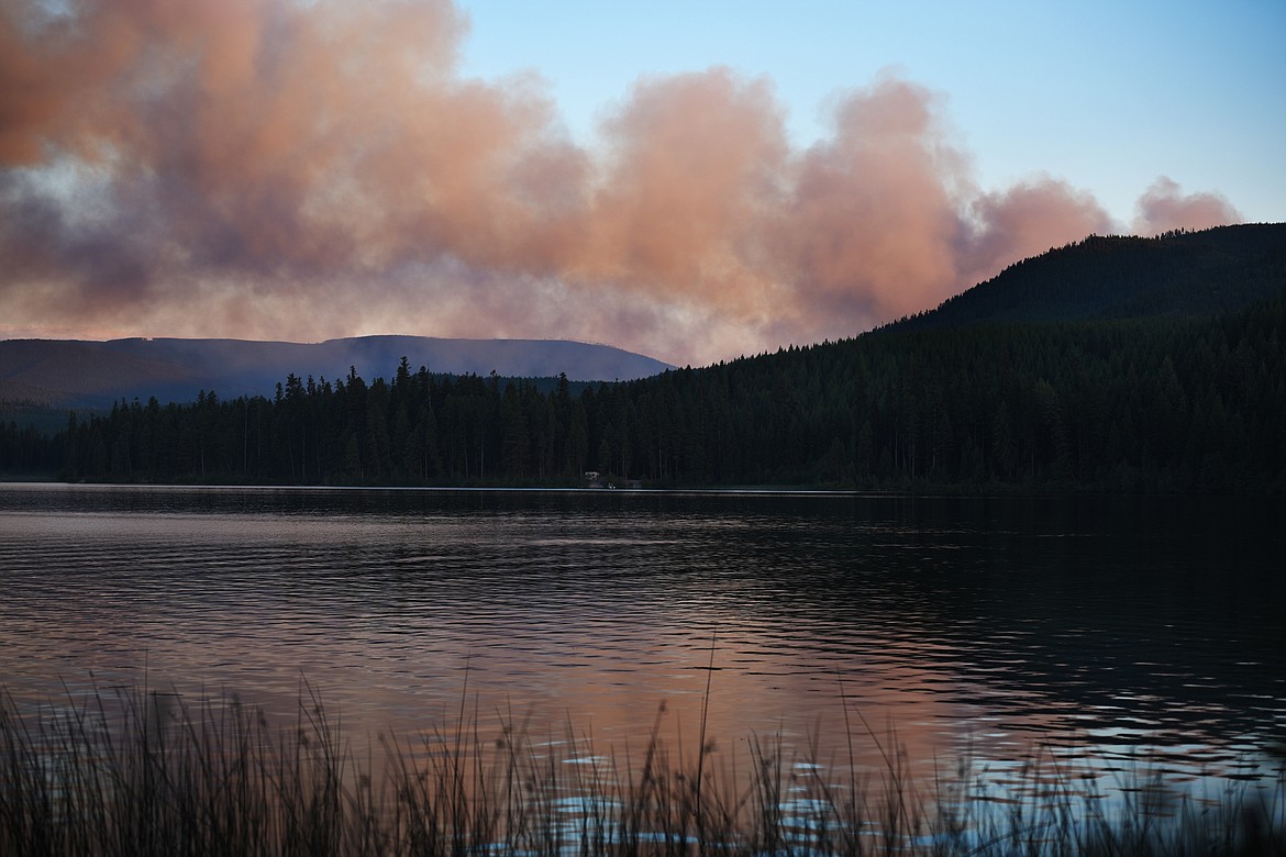 Smoke from a wildfire fills the sky over Lower Thompson Lake at sunset on Sunday. Smoke from several regional fires had made its way into the Flathead Valley by Sunday. (Brenda Ahearn/Daily Inter Lake)