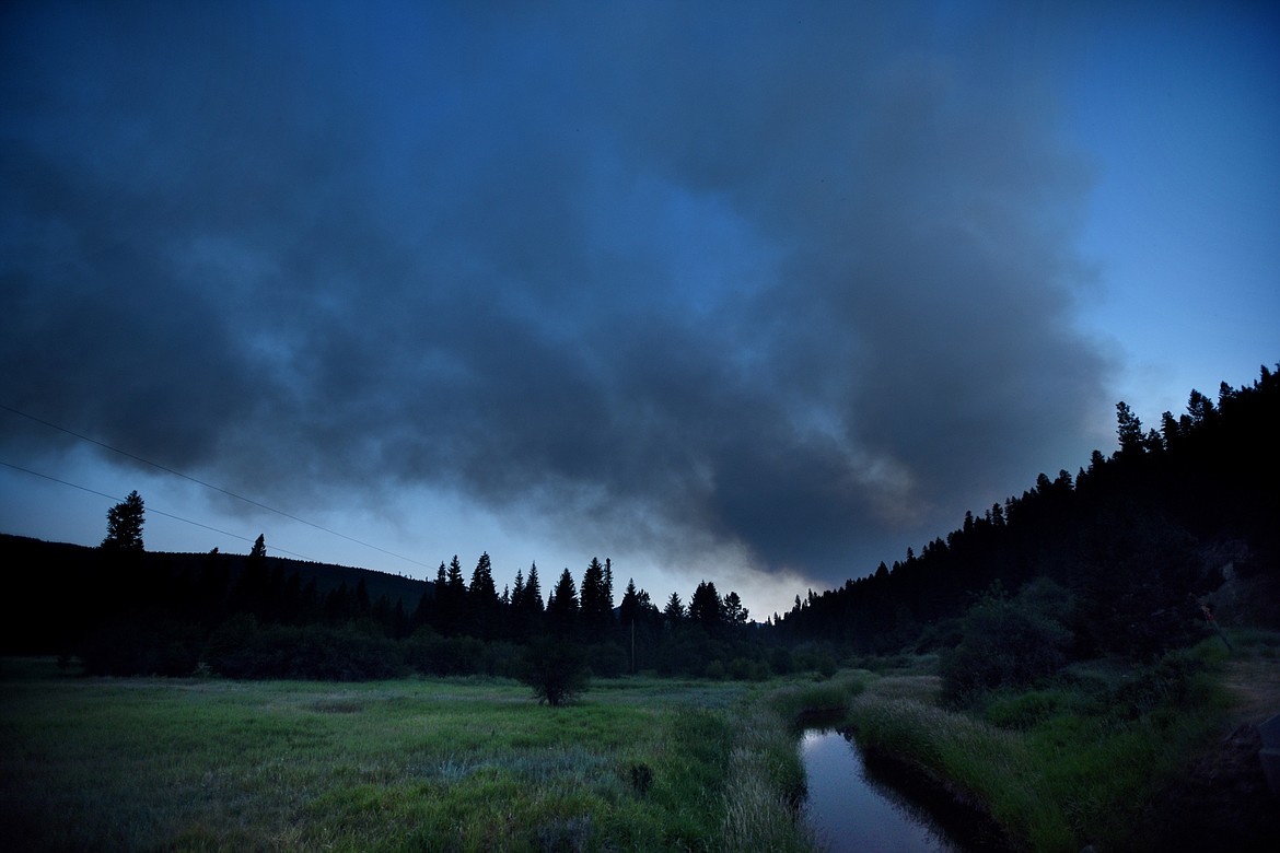 Smoke clouds fill the sky near the county border between Flathead and Lincoln on Sunday night, July 9.(Brenda Ahearn/Daily Inter Lake)