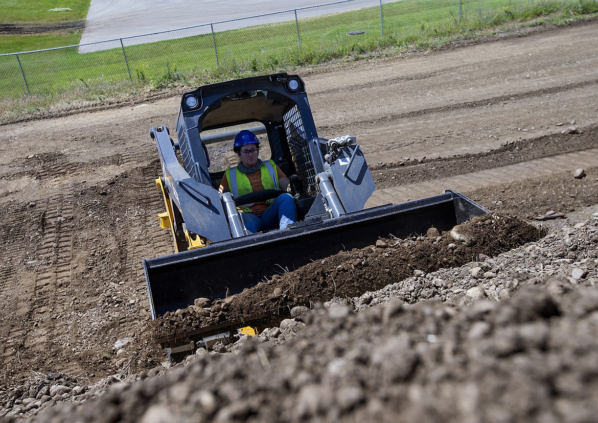 LOREN BENOIT/Press

Coeur d'Alene's Michelle Nelson operates a mini excavator during a heavy equipment showcase for potential contractors at the Kootenai Technical Education Campus on Thursday. The program has opened a new opportunity for Nelson, who has worked as an internet search engine writer.