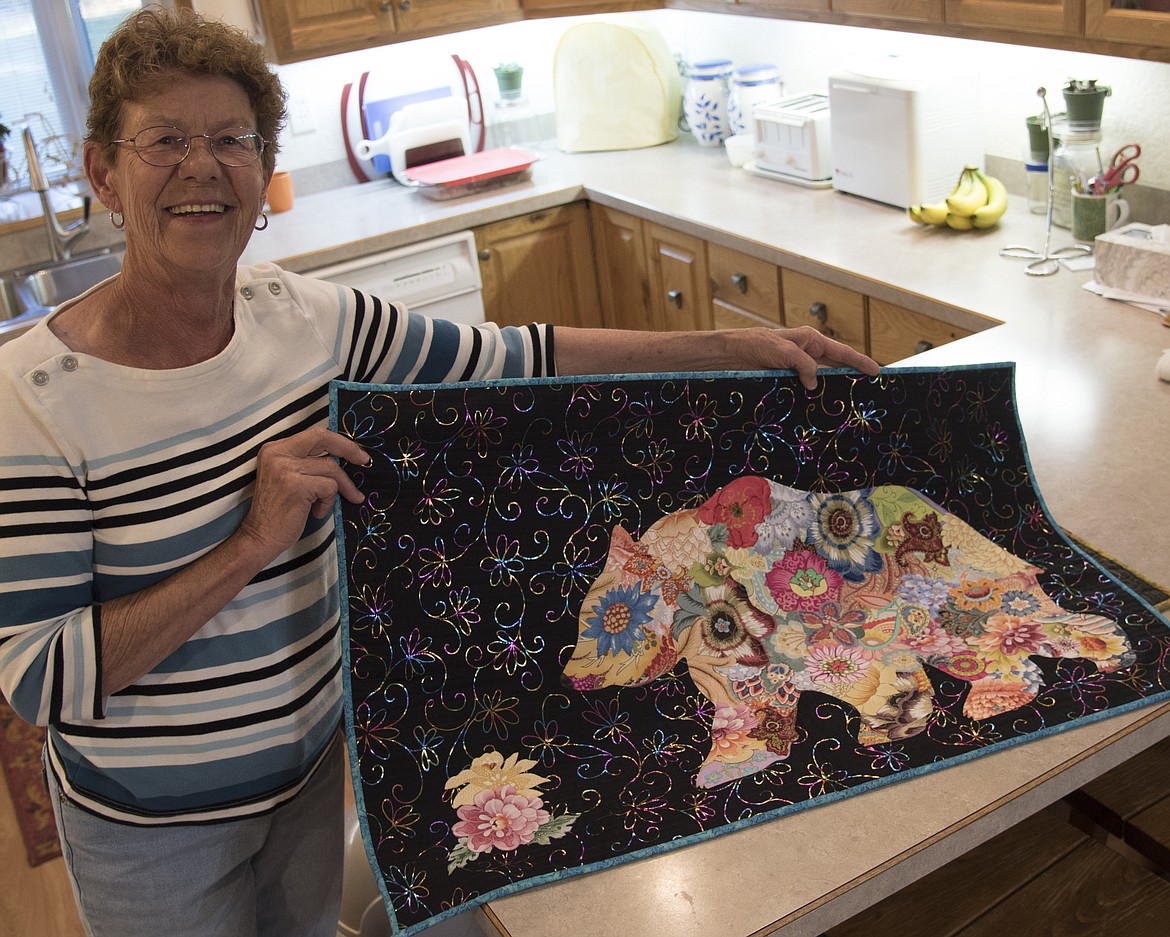 Deleen Winters shows one of her quilt art pieces that will be displayed at the upcoming Mission Valley Quilters Guild Show. (Marla Hall/Lake County Leader)