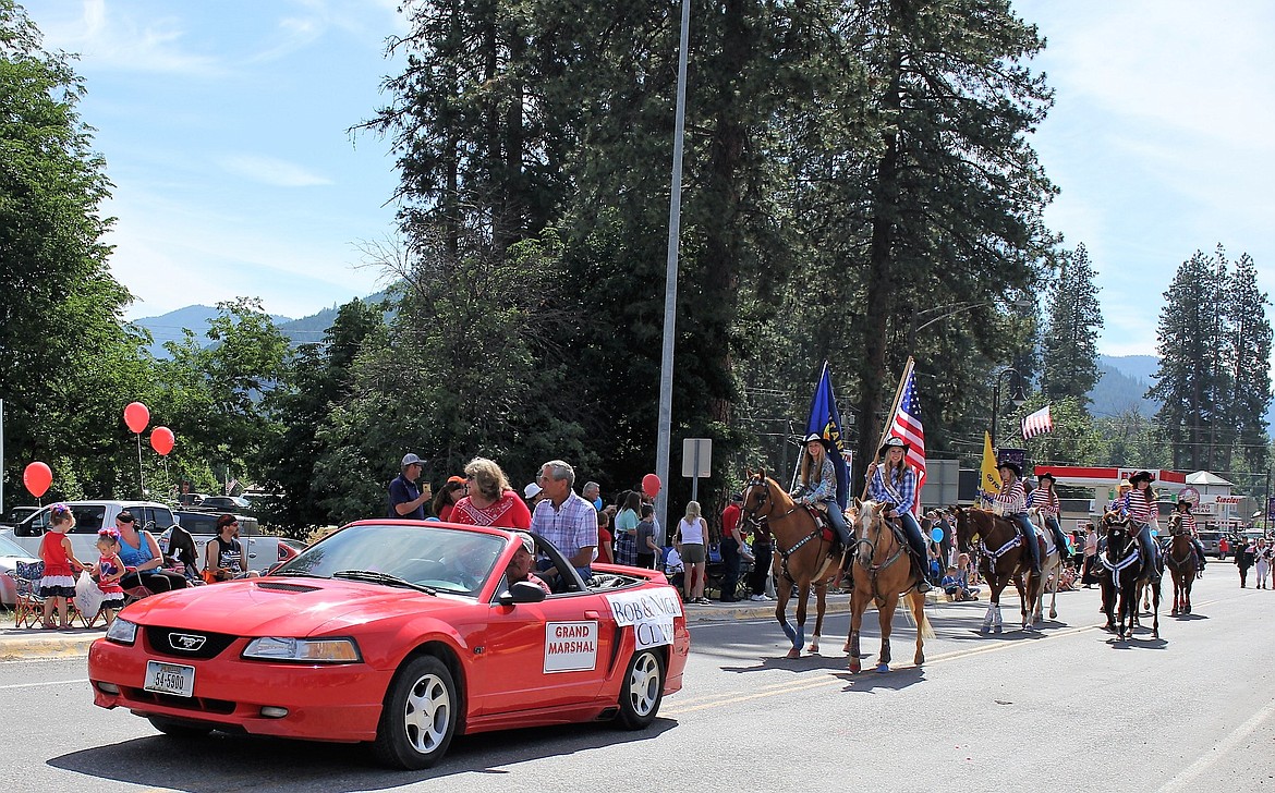The grand marshals for the St. Regis Fourth of July parade were Bob and Nicki Clyde followed by Jonna Warnken and Madison Hill carrying the Montana and American Flag on horseback.