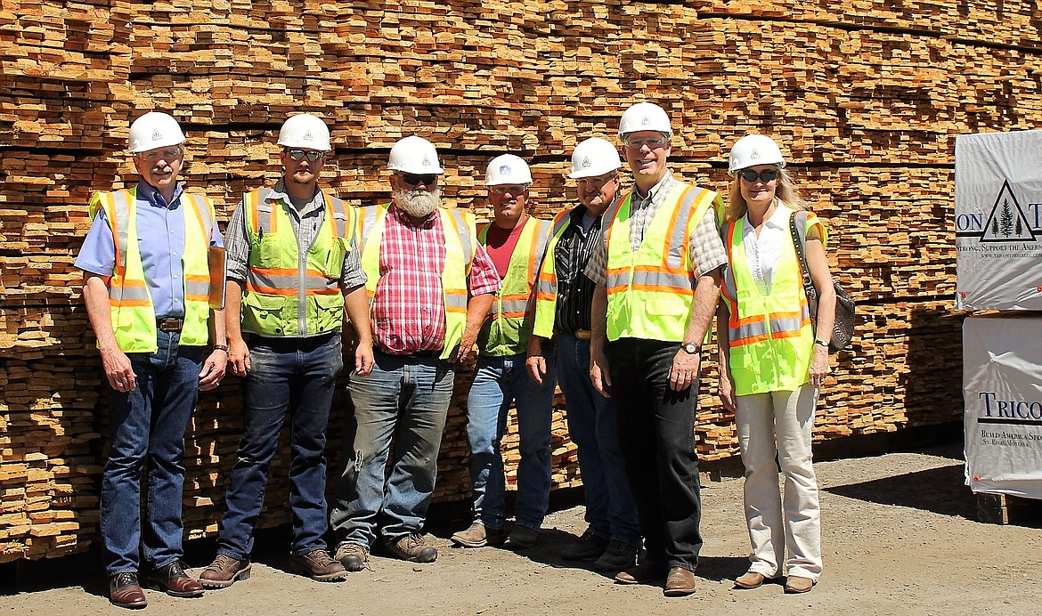 Jim Arney (far left), Calvin Sheahan, Denley Loge, Angelo Ververis, and Willy Peck tour Tricon Timber with Greg and Susan Gianforte (far right) on July 3, 2017. (Kathleen Woodford/Mineral Independent).