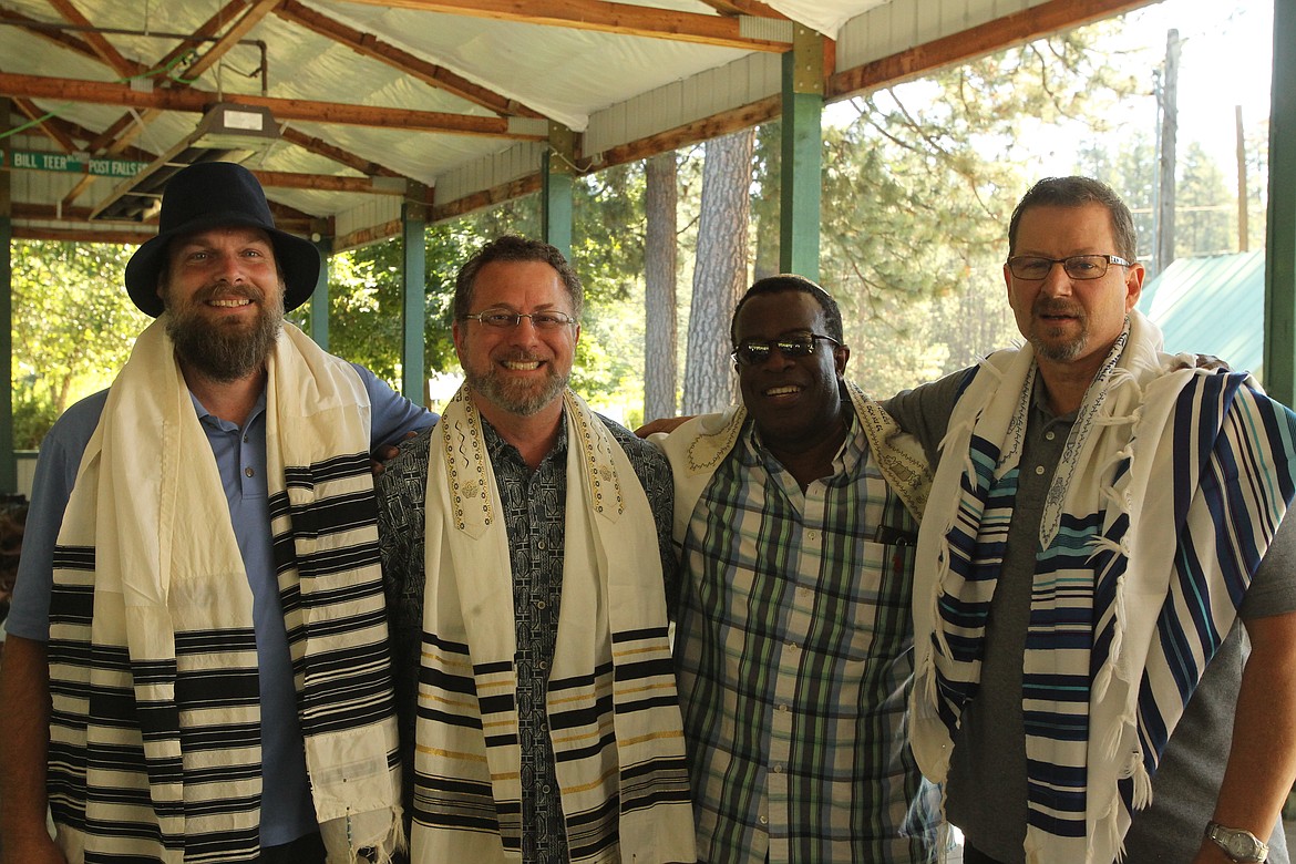 MITCHELL BONDS/Press
Members of the Beth Shalom messianic Jewish community, from left, Ryan Smith, John Popp, Christopher Bonner Holland and Bill Miller attended the Community Worship and Prayer Service at the Post Falls Festival Sunday morning. Smith delivered a traditional Aaronic benediction in Hebrew during the event.