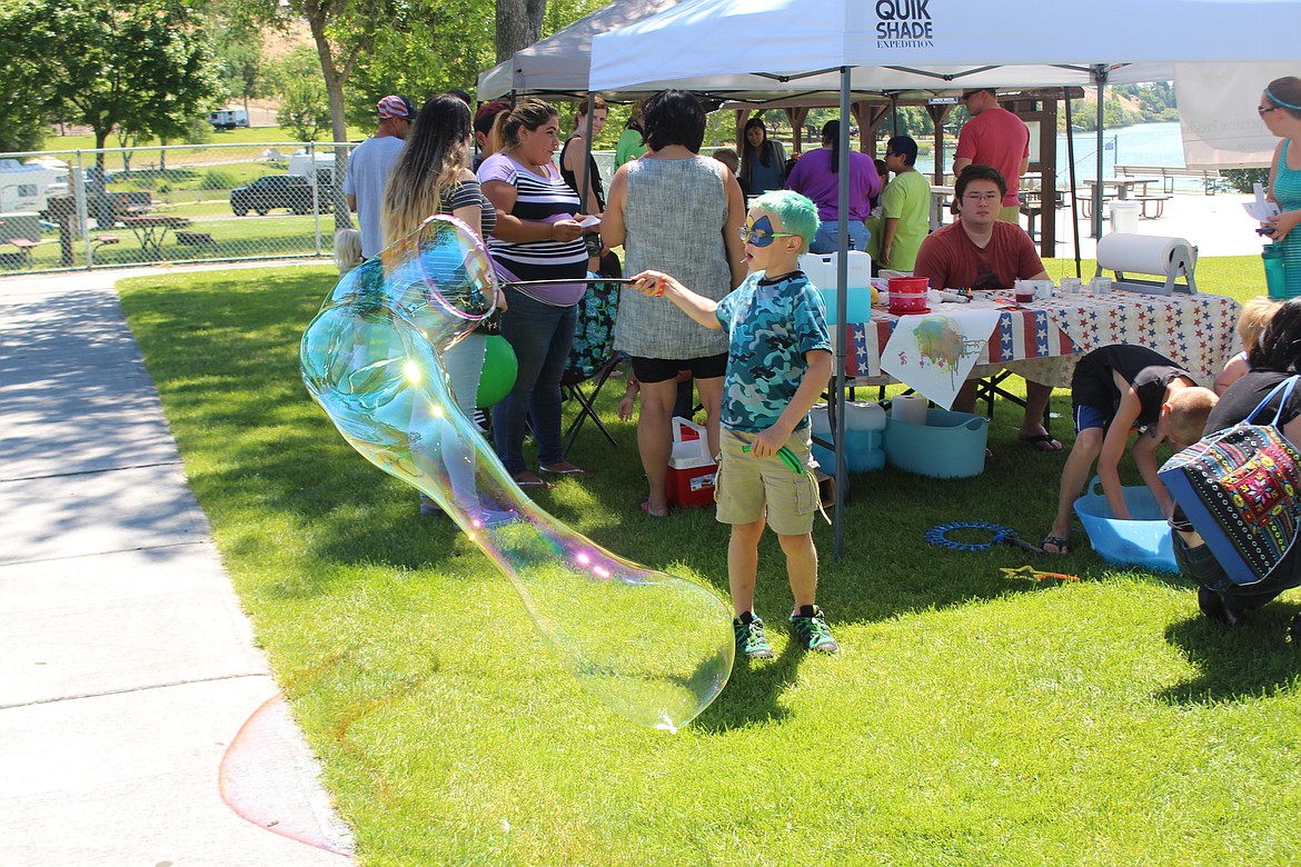 Cheryl Schweizer/Columbia Basin Herald
There were bubbles and face painting and hair painting and &#8211; oh, yes, the rubber duck race at the Duck Derby sponsored by the Boys and Girls Club Saturday.