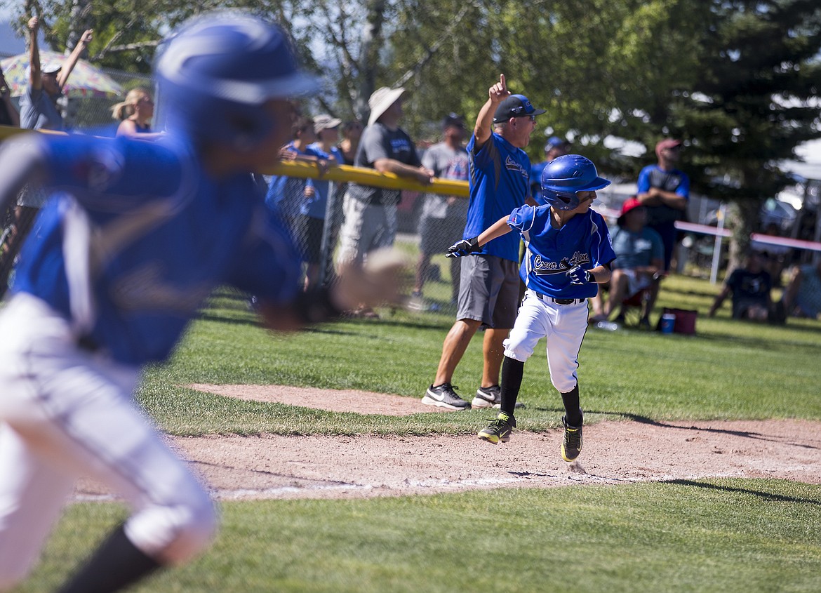 LOREN BENOIT/Press
Zach Bell of Coeur d&#146;Alene runs toward home to score on a hit in a game against Southwest Ada in Game 1 of the best-of-3 Little League age 8-10 state championship series Friday at Croffoot Park in Hayden.