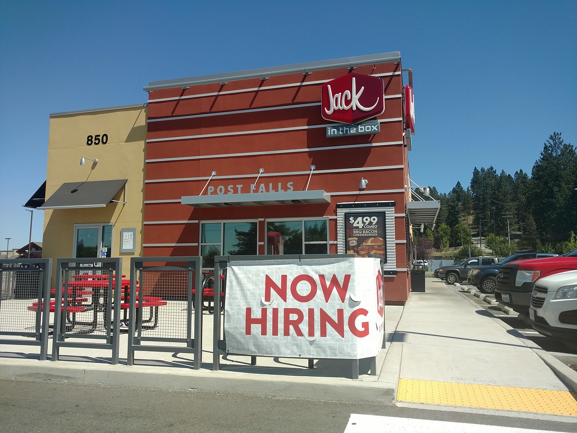 This large &#147;now hiring&#148; sign is easily read by drivers who pass the Jack in the Box at Mullan Avenue and Highway 41 in Post Falls.