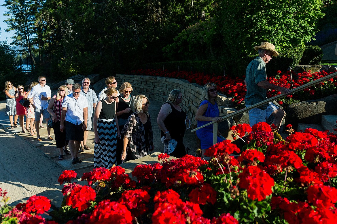 SHAWN GUST/Press FileGuests, arriving from a cruise boat, make their way up the beach to the Hagadone&#146;s Lake Coeur d&#146;Alene home in 2015.