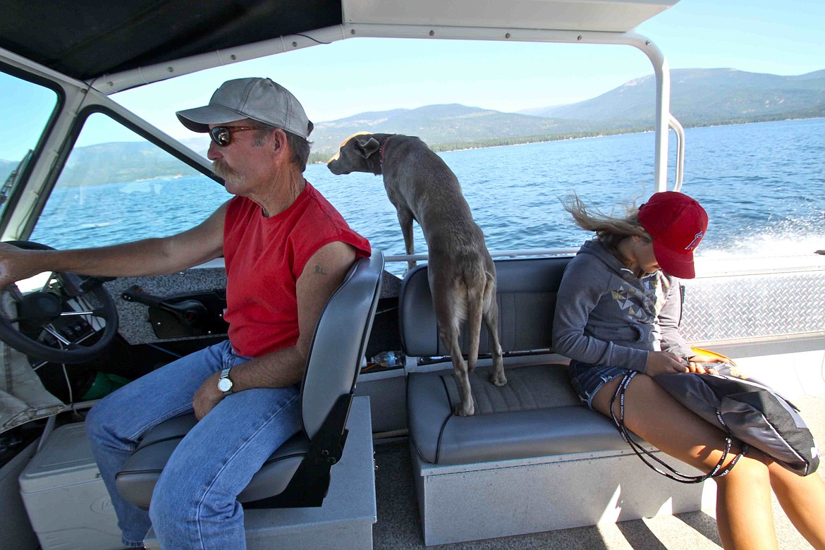 RALPH BARTHOLDT/Press
Priest Lake mackinaw guide Rich Lindsey, his boat dog, Rider, and angler Livvy Bartholdt head back to the dock after a six-fish outing on the lake in the Panhandle&#146;s northwest corner.