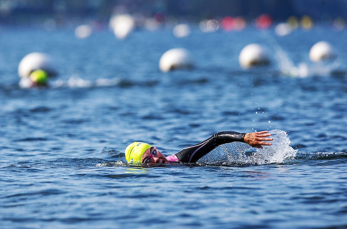 TESS FREEMAN/Press File
Danielle Parks of Coeur d&#146;Alene swims toward the finish line of the Coeur d&#146;Alene Crossing in this 2014 file photo. The 2.4-mile swim starts at Arrow Point and finishes at the Hagadone Event Center, while those swimming the 1.2-mile half Crossing will jump into the water from a boat and swim the shorter distance to the finish. Early-bird signups end Monday but registration will be open until Aug. 10. The Crossing takes place early the morning of Aug. 13.