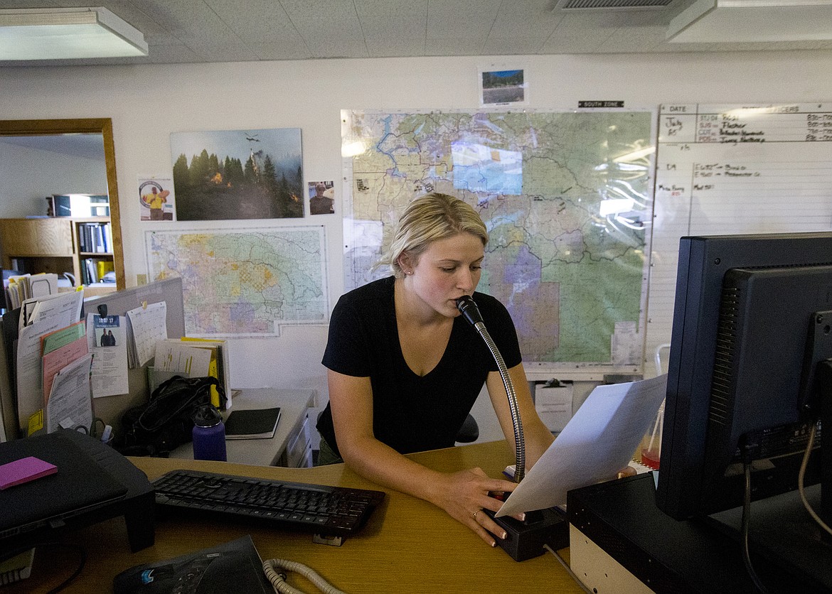 LOREN BENOIT/PressCoeur d'Alene Interagency dispatcher Shyenne Badertscher gives a report about weather and fire conditions Tuesday afternoon at the dispatch center at the Coeur d'Alene Airport.