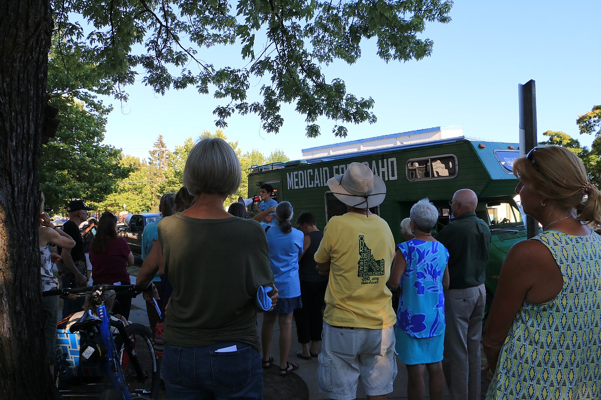 (Photo by MARY MALONE)
Reclaim Idaho co-founder Luke Mayville, pictured with the megaphone, kicked off the Medicaid for Idaho tour Tuesday at Farmin Park with a debut of the &#147;Medicaid Mobile,&#148; which began its statewide journey this week to bring awareness to Idaho&#146;s health care coverage gap.