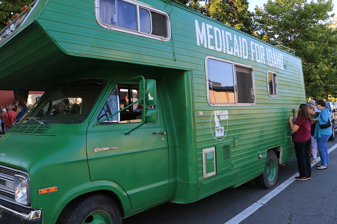 (Photo by MARY MALONE)
Sandpoint community members were the first to sign Reclaim Idaho's &quot;Medicaid Mobile&quot; as it begins a statewide journey to bring awareness to Idaho's health care coverage gap.