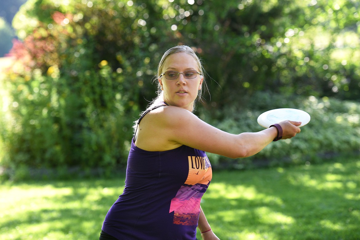 Heather Franks throws her disc during the Flathead Valley Disc Golf league night at Lawrence Park on Tuesday. (Aaric Bryan/Daily Inter Lake)